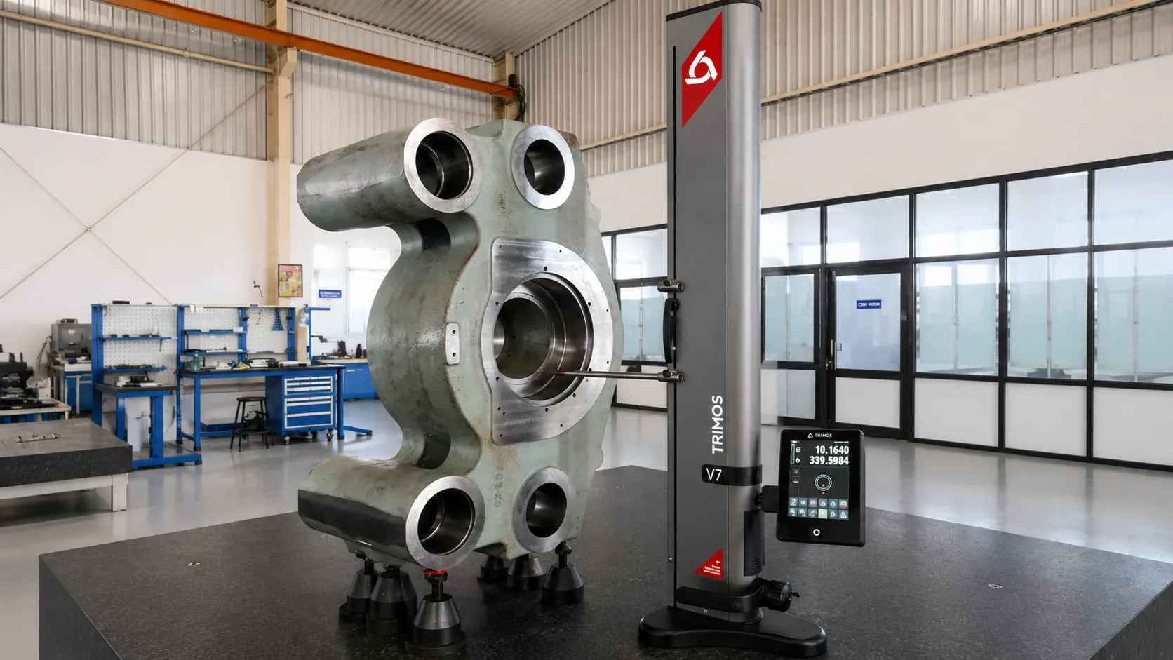 Multi-bore housing component beside height gauge