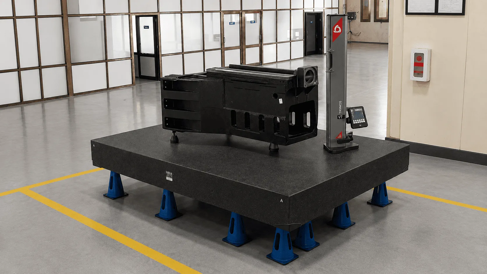 Machined housing block on granite inspection table